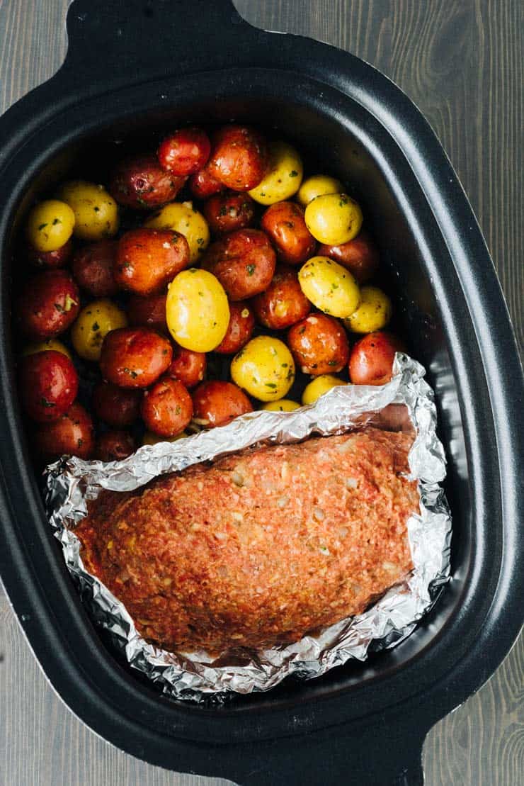 Slow Cooker Meatloaf and Potatoes and garlic butter. Tender and Perfect!