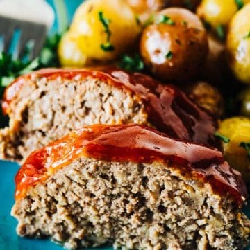 Slow Cooker Meatloaf and Potatoes and garlic butter. Tender and Perfect!