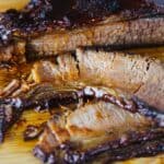 Instant Pot Beef Brisket on wood cutting board