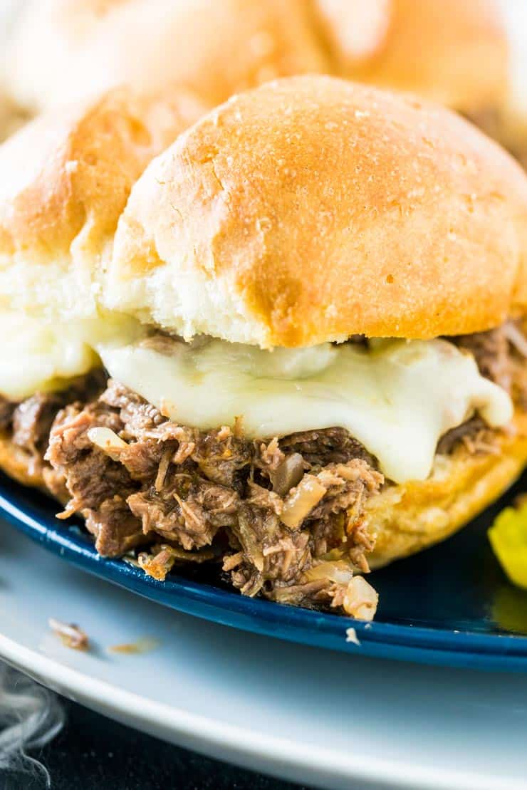 A Crockpot Italian Beef Sandwich with Provolone cheese