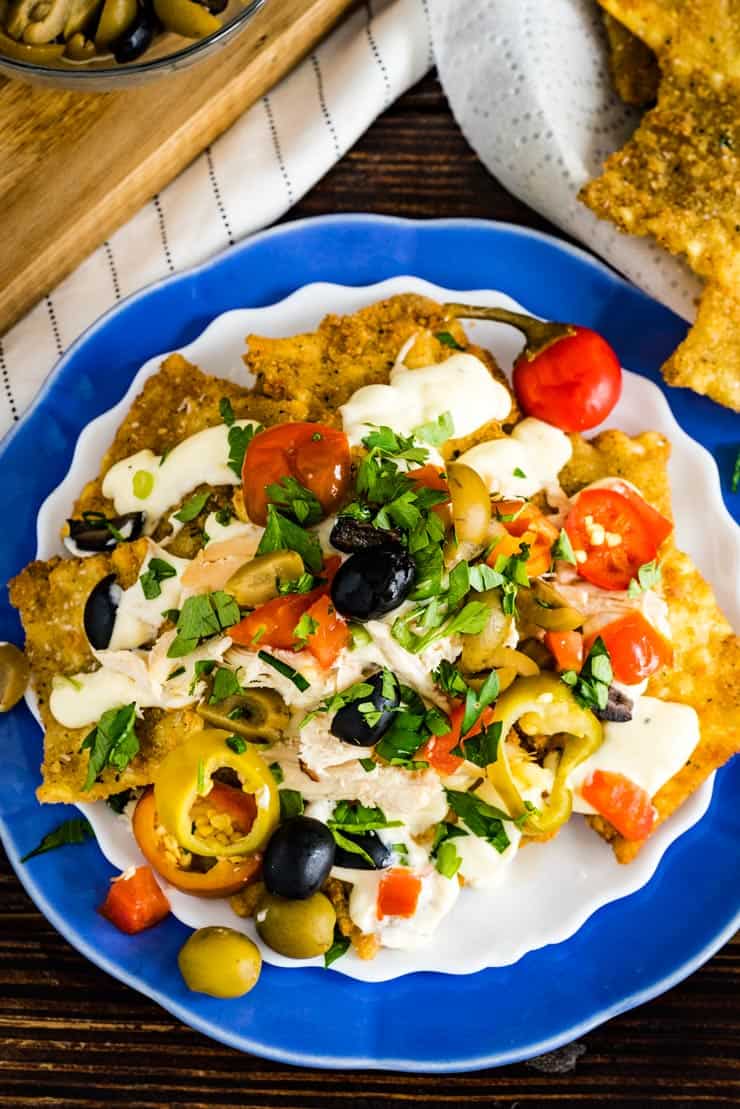 Italian Nachos made on fried pasta chips and topped with homemade alfredo sauce