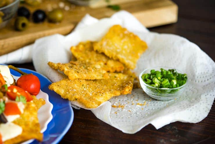 Fried pasta chips on a paper towel ready to make Italian Nachos