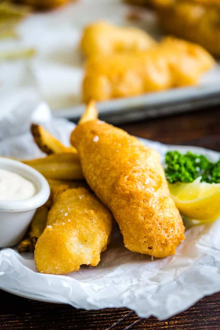 Beer Battered White Fish on a plate with homemade french fries and tartar sauce