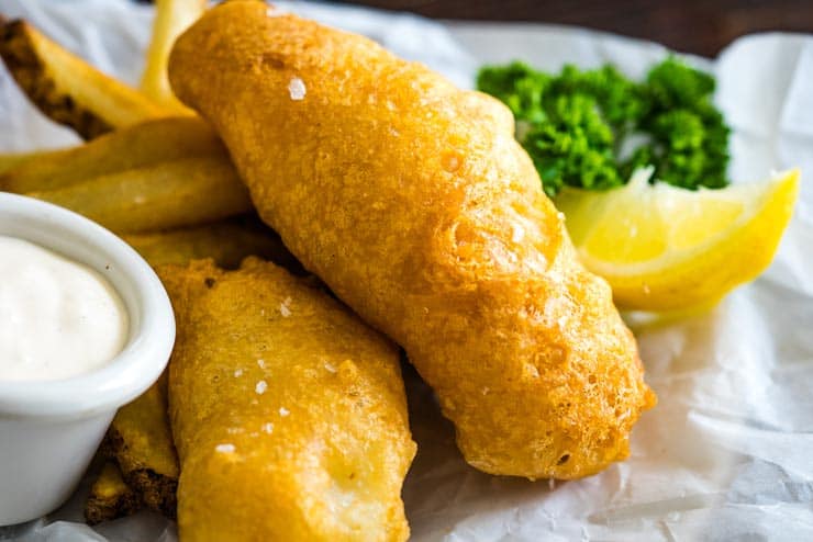 Battered white fish on parchment paper