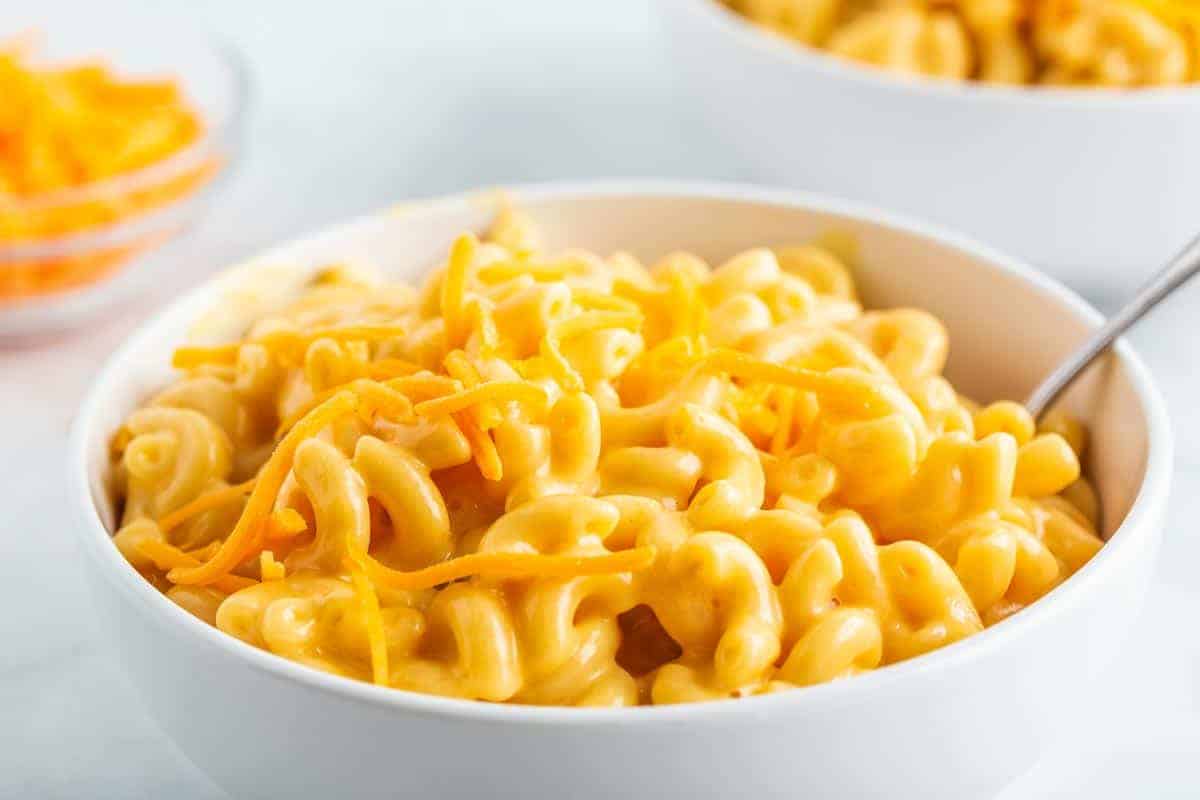 Bowl of and cheese with cheese on top