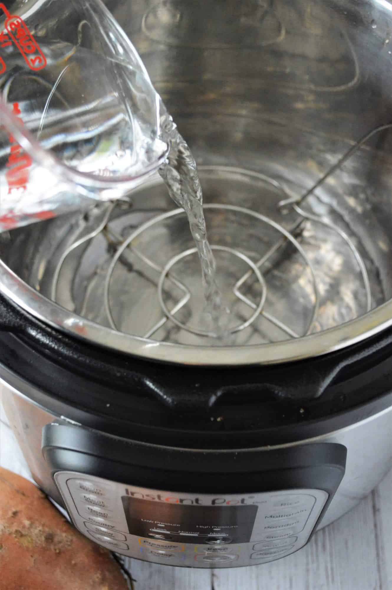 Water being poured into an Instant Pot